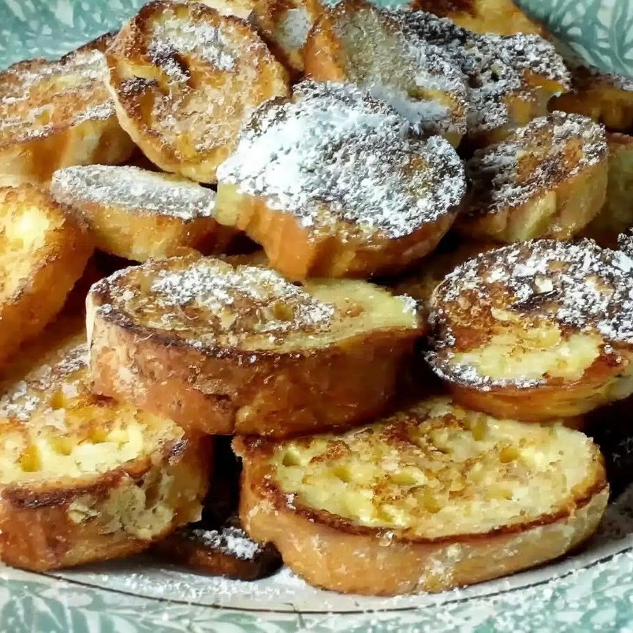 Pain Perdu: Golden Pain Perdu , French toast made from stale bread — thick slices fried in butter and dusted with powdered sugar, a classic French Waste-Not Want-Not recipe from a Santa Barbara cooking class